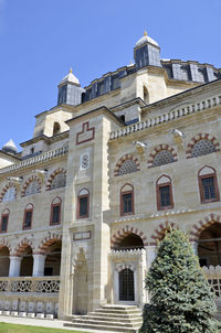 Low angle view of building against blue sky