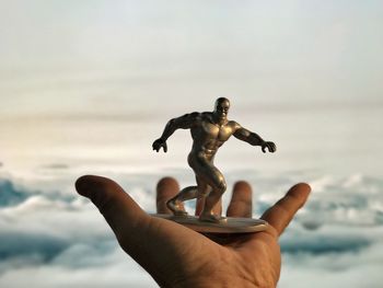 Low angle view of man at beach against sky