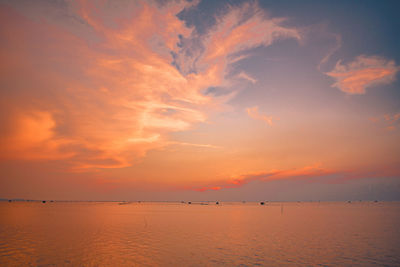 Scenic view of sea against orange sky