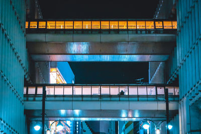 Low angle view of illuminated modern building at night