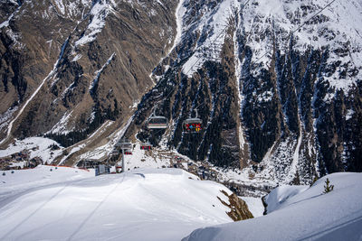 Family in the ski area in tirol in the chair lift