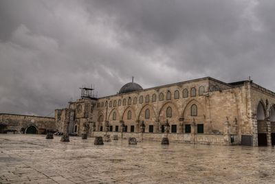 Historic building against cloudy sky