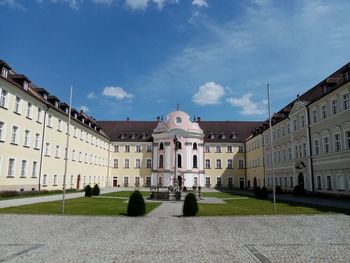 Facade of historic building against blue sky