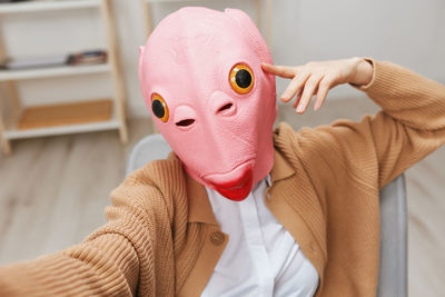 Midsection of woman wearing mask