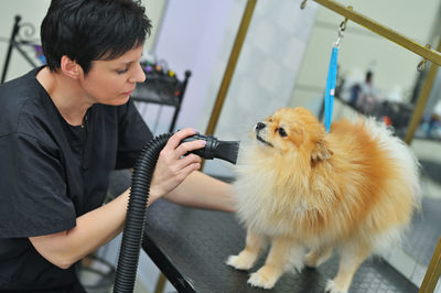 Side view of man with dog