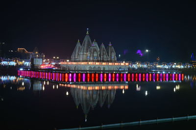 Illuminated buildings in city at night