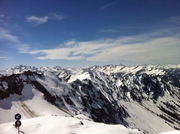 Scenic view of snowcapped mountains against sky