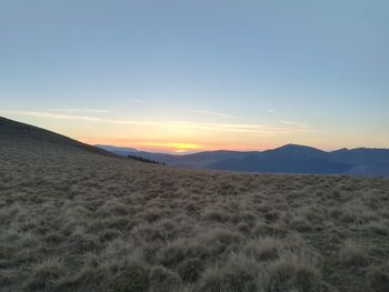 Scenic view of landscape against sky during sunset