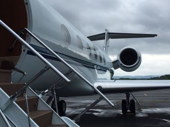 Close-up of airplane against sky