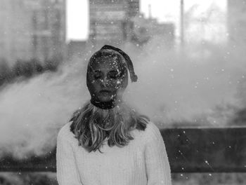 Portrait of woman standing in snow