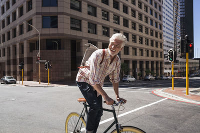 Mature man riding bicycle in the city