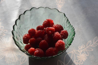 High angle view of strawberries in bowl on table