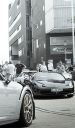 People on road against buildings