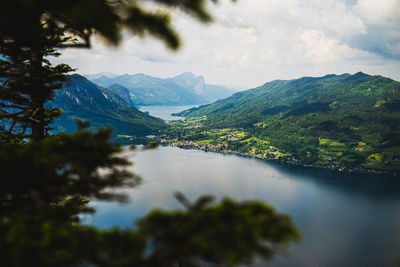 Scenic view of lake and mountains against sky