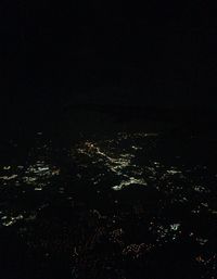 High angle view of illuminated buildings in city at night