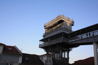 Low angle view of building against clear blue sky