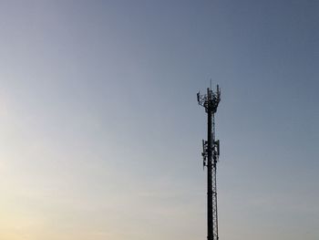 Low angle view of communications tower against sky