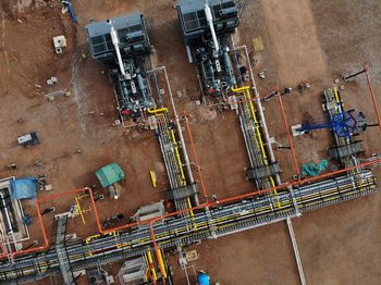 High angle view of construction site by buildings in city