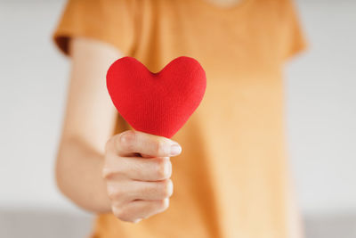 Close-up of hand holding heart shape