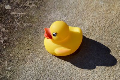 High angle view of yellow toy on land