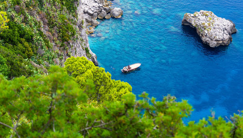 High angle view of rocks on sea