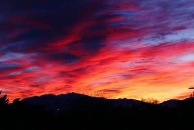 Silhouette of mountain range at sunset