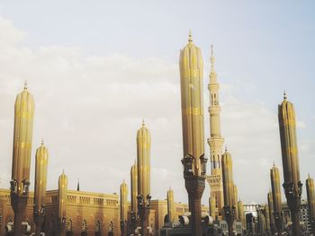 Panoramic view of buildings in city against sky