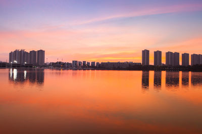 Scenic view of bay against sky during sunset