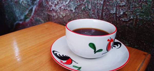 Close-up of coffee cup on table