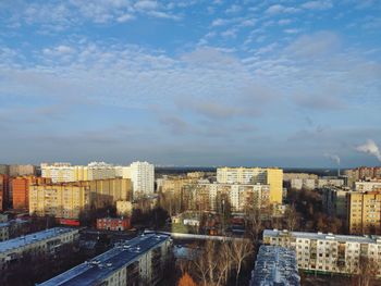 High angle view of buildings in city against sky