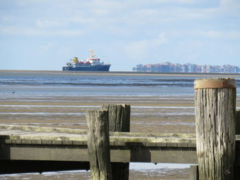 Pier over sea against sky