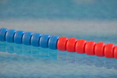 Close-up of water in row against sea