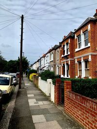 Street amidst buildings against sky