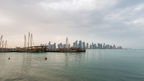 Boats on sea against sky