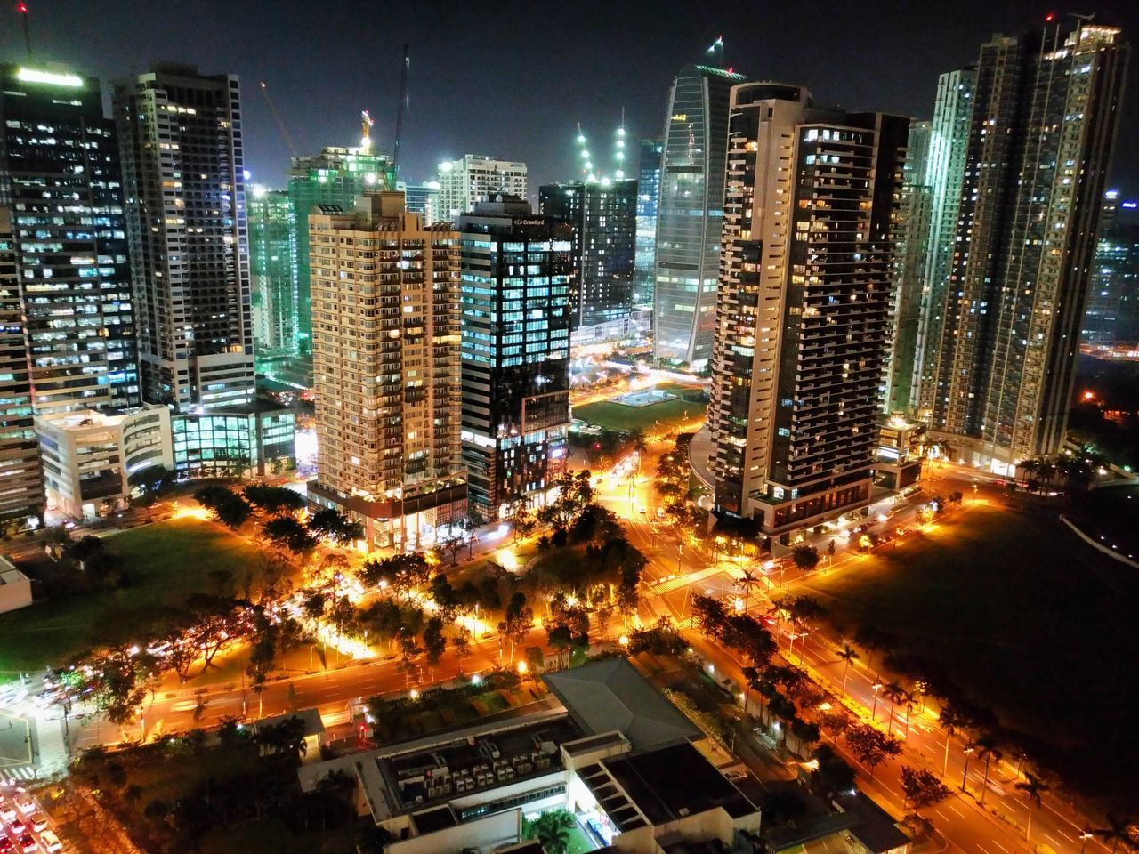 HIGH ANGLE VIEW OF CITYSCAPE AT NIGHT