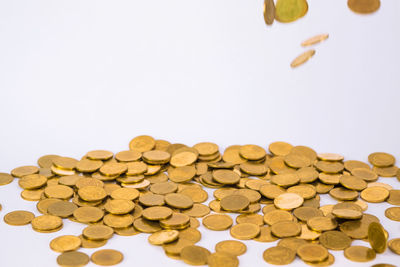 Close-up of coins on white background