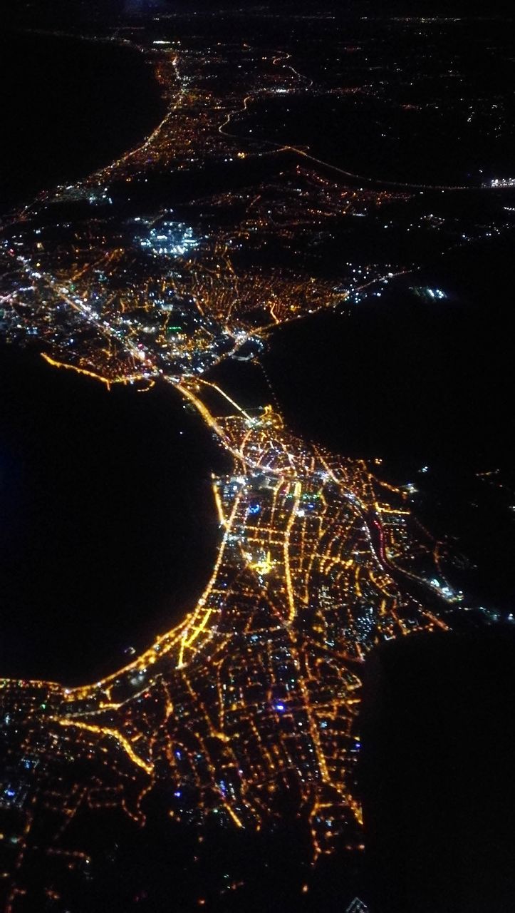 night, illuminated, no people, nature, glowing, outdoors, sky, motion, aerial view, architecture, pattern, light - natural phenomenon, cityscape, city, star - space, astronomy, water, creativity, light, building exterior, black background, power in nature