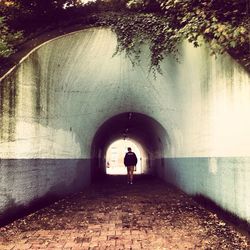 People walking in tunnel