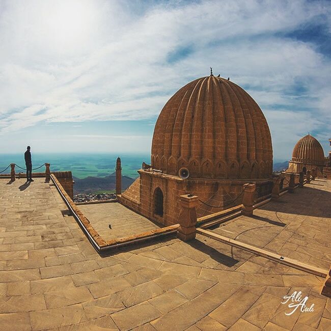 sky, architecture, built structure, building exterior, cloud - sky, dome, tourism, sea, travel destinations, place of worship, travel, famous place, religion, cloud, horizon over water, history, spirituality, water, tourist