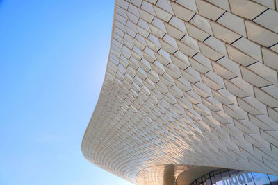 Low angle view of building against blue sky