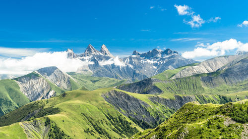 Scenic view of mountains against cloudy sky