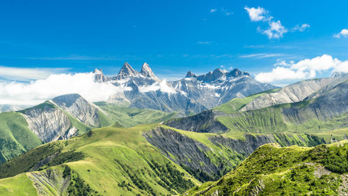 Scenic view of mountains against cloudy sky