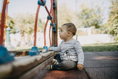 Boy looking away in the playground