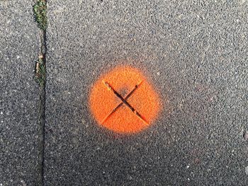 High angle view of arrow sign on road