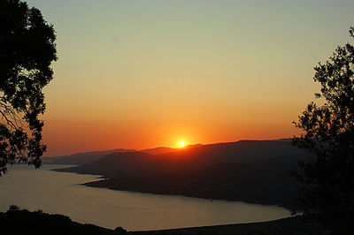 Scenic view of lake against sky during sunset