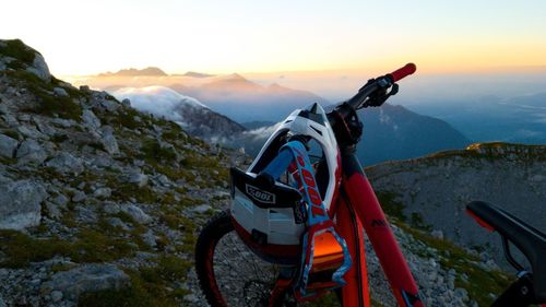 Scenic view of snowcapped mountains against sky during sunset