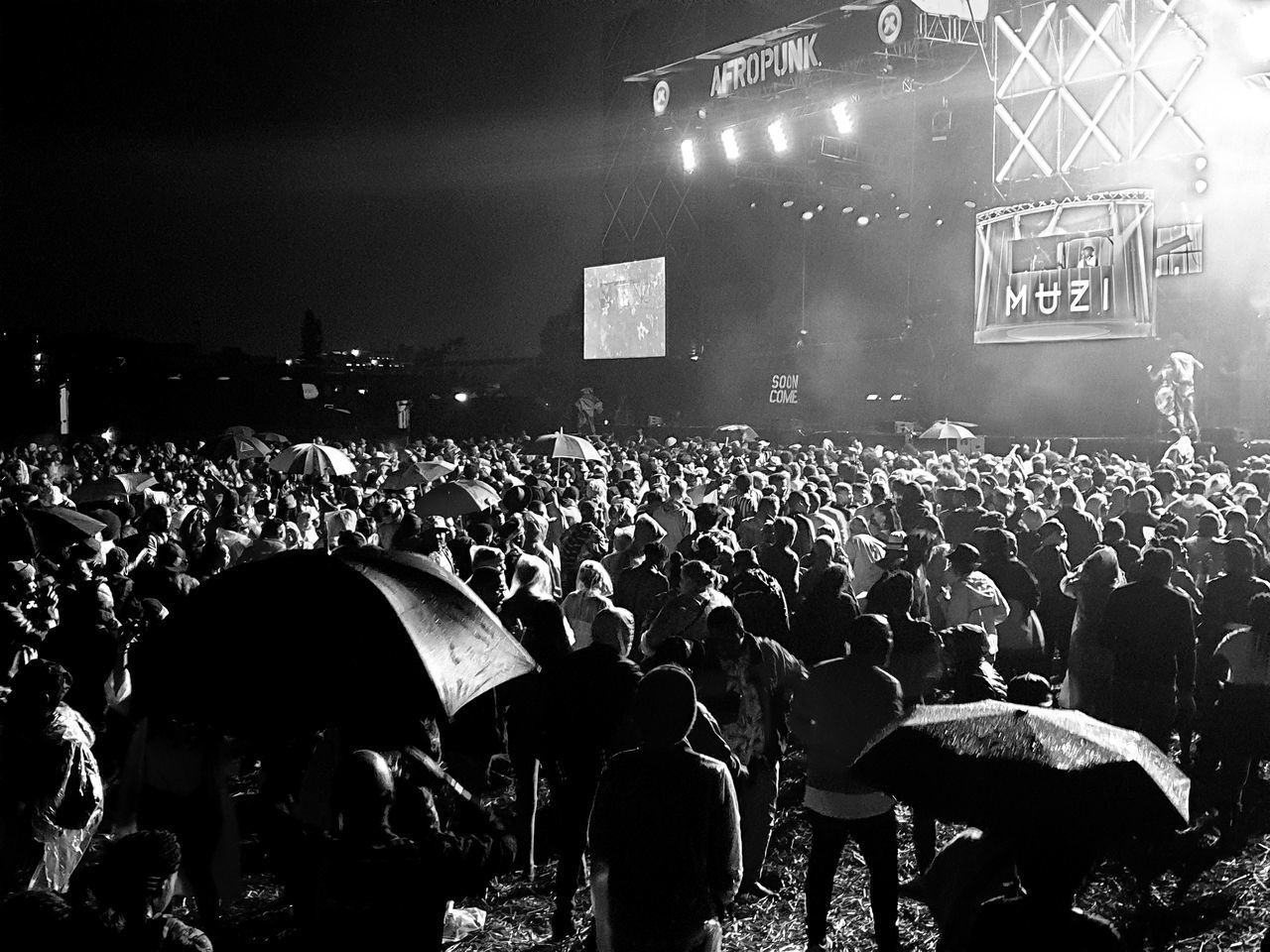 GROUP OF PEOPLE IN THE DARK