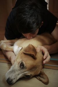 Cute boy with dog at home