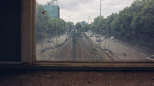 Railroad tracks seen through train window