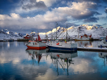 Boats moored at harbor